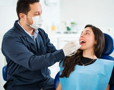 Women testing a teeth with doctor